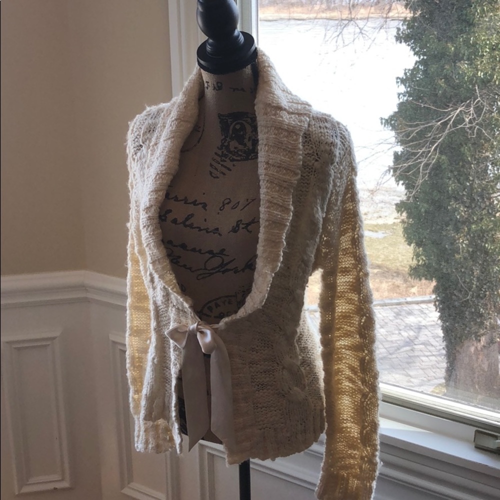 Cream cable sweater with satin tie closure
